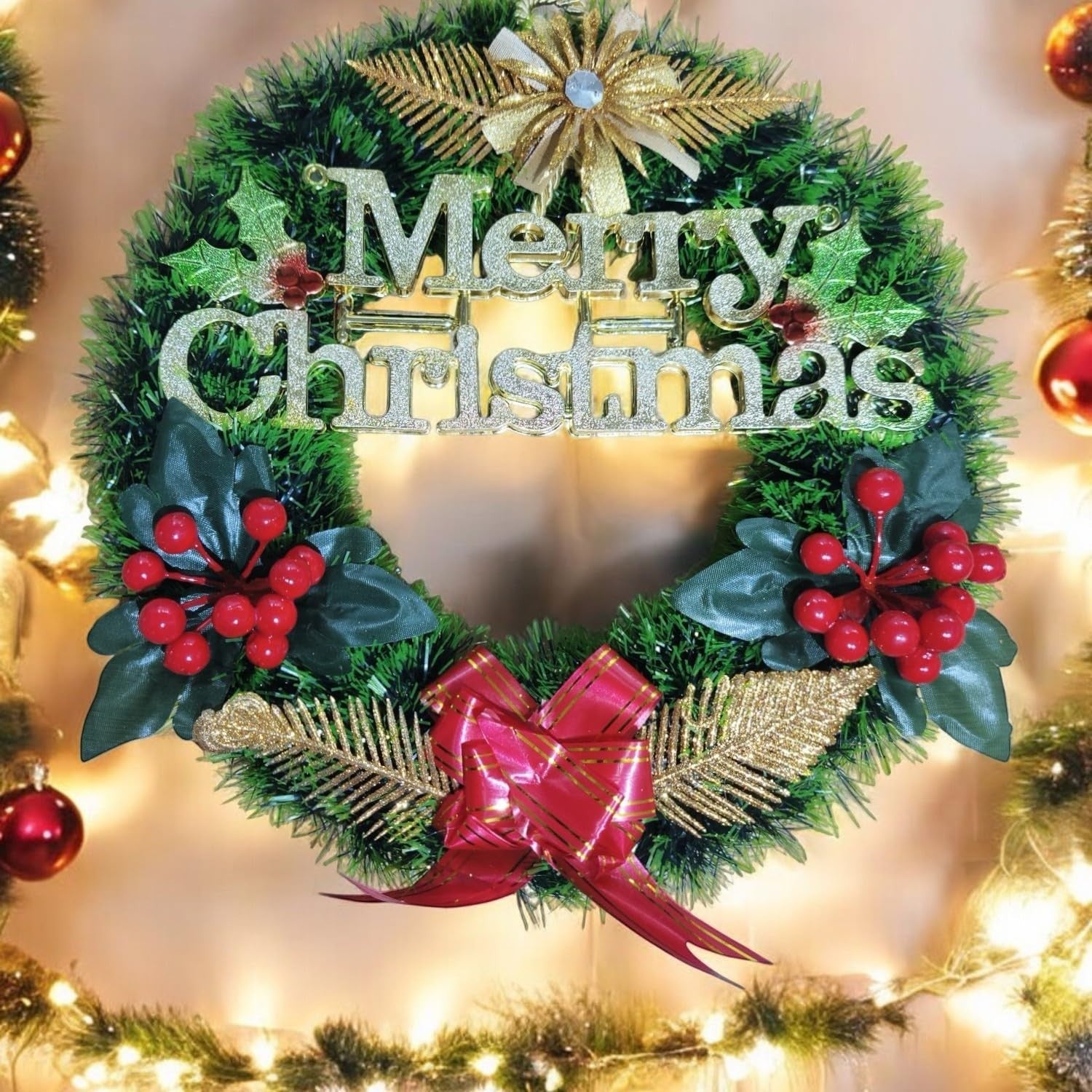 Go Hooked green Christmas wreath with "Merry Christmas" glitter text, red berries, gold accents, and a red bow.