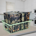 GoHooked green metal wire grid basket holding two large gift-wrapped boxes with snowflake and ornament design.
