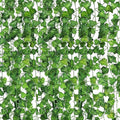 Go Hooked pack of 5 green plastic linden leaf artificial hanging creepers, 7 ft each, for home decor.