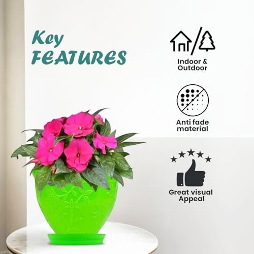 Go Hooked green plastic planter pot with embossed floral design and pink impatiens flowers, includes matching saucer. Indoor/outdoor use.
