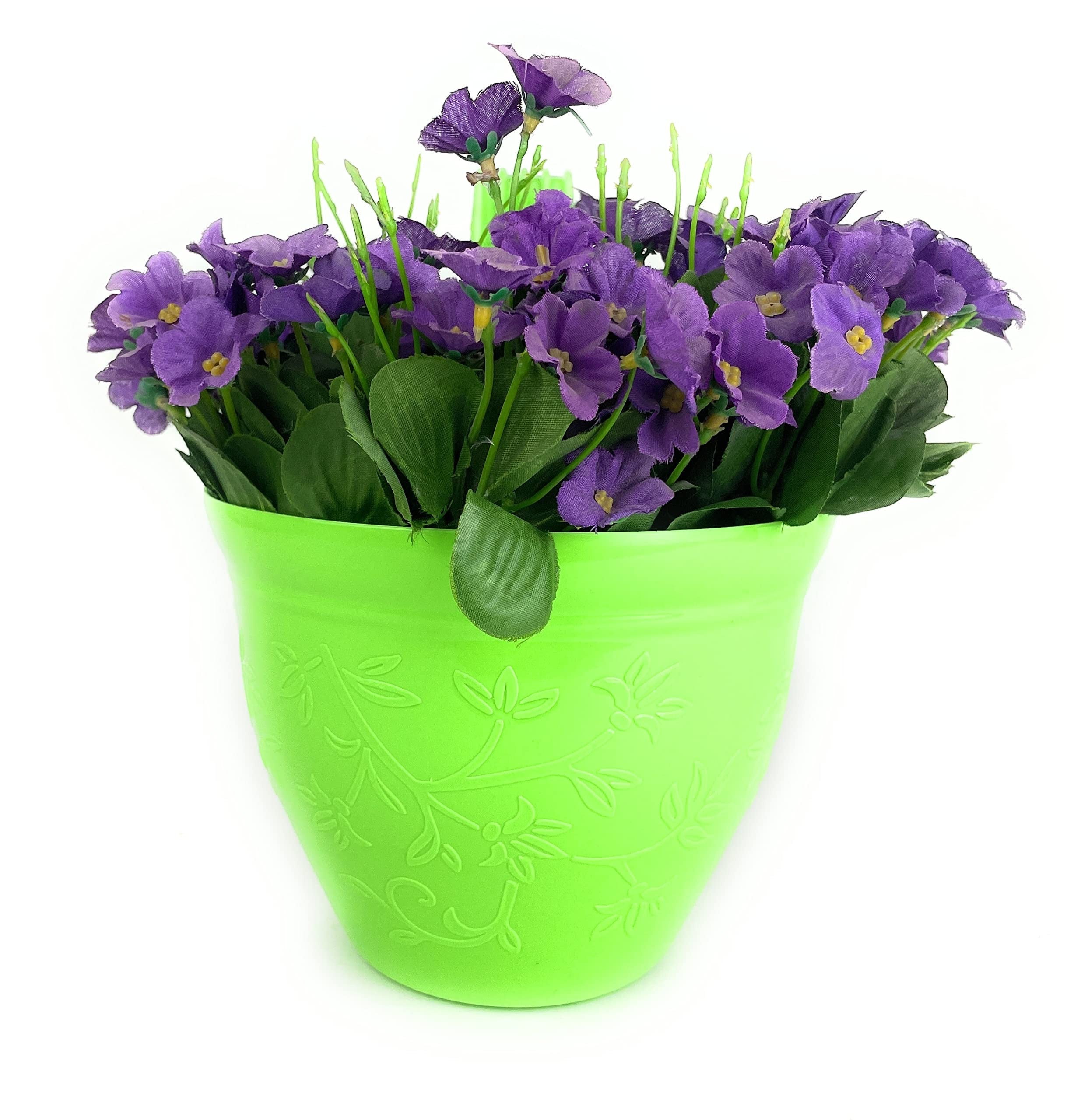 GoHooked bright green plastic hanging planter with embossed floral design, filled with purple artificial flowers and green leaves.