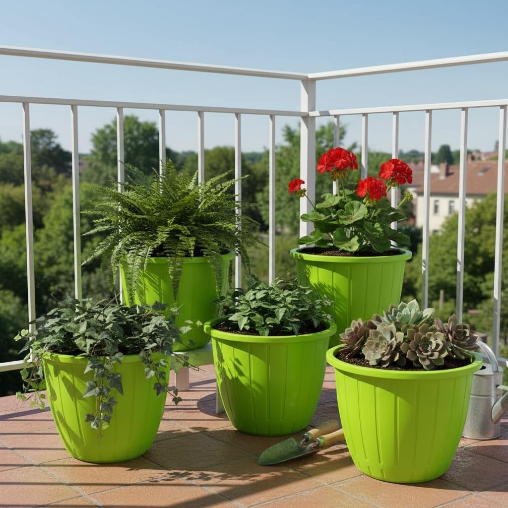 Go Hooked 10-inch green plastic planters with vertical ribbing, holding various plants on a balcony.