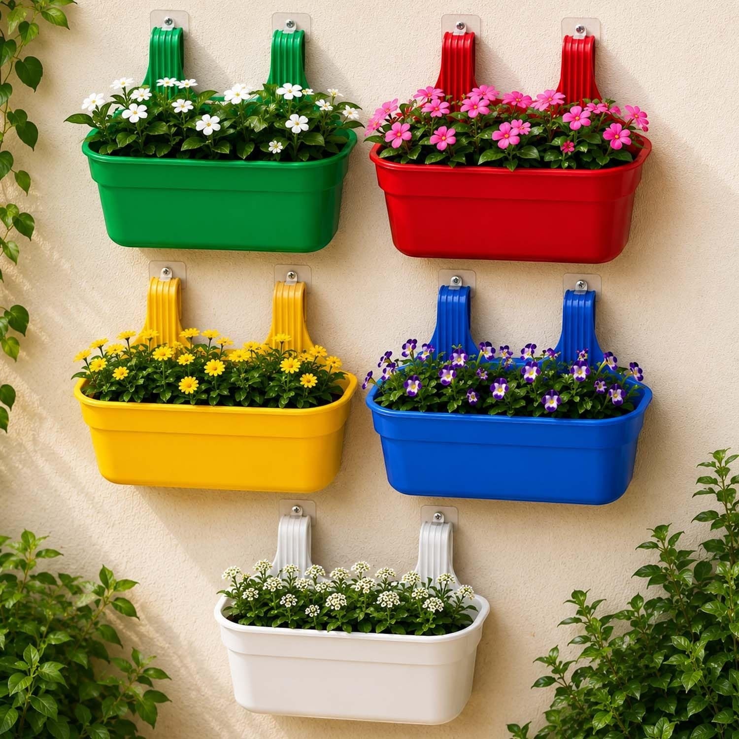 Go Hooked set of 10 green plastic railing hanging planters filled with flowers. Rectangular pots with double hooks for balconies and fences.