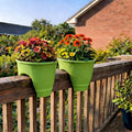 Go Hooked green plastic railing planters with colorful flowers, perfect for balconies and gardens. Set of 2.