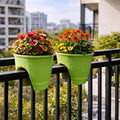 GoHooked set of 2 green plastic 12-inch railing planters with colorful flowers on a balcony.