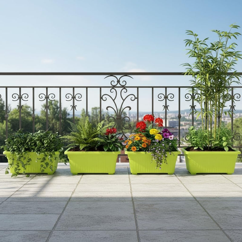 Go Hooked set of 4 green rectangular plastic planters with various plants and flowers on a balcony.