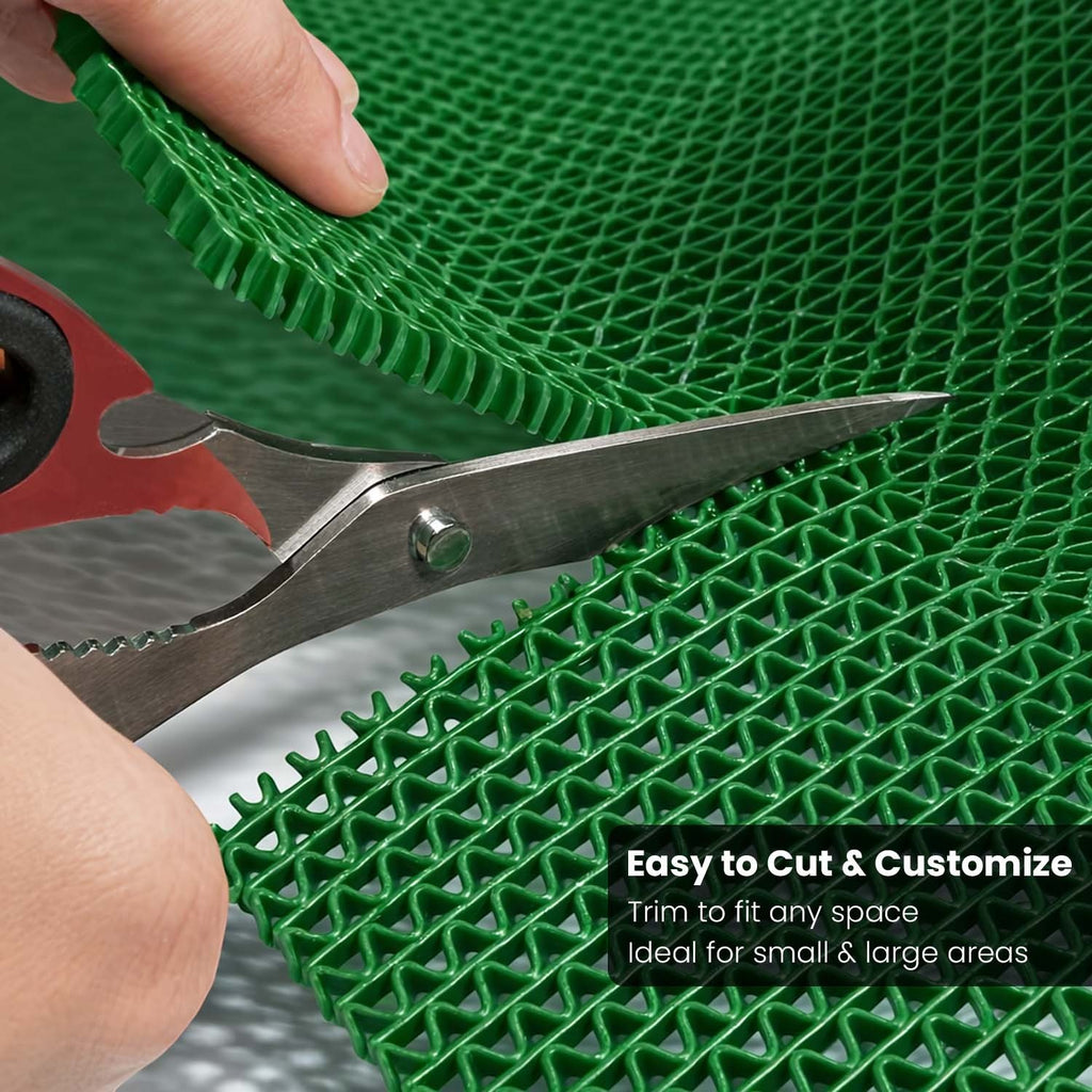 GoHooked green anti-skid rubber bathroom mat being trimmed with scissors for a custom fit in wet areas.