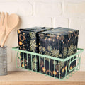 Go Hooked green wire grid basket holding two wrapped gifts with snowflake and ornament design.