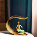 Go Hooked green polyresin meditating yoga woman statue with gold accents, seated in lotus pose.