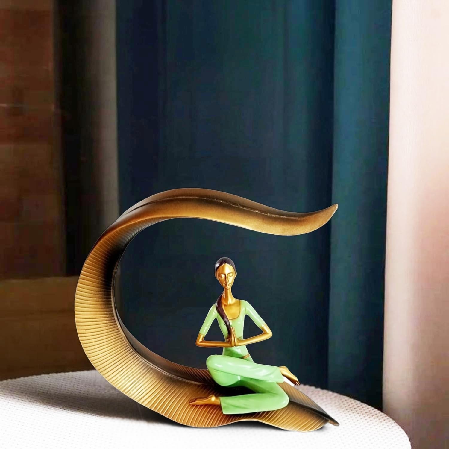 Go Hooked green polyresin meditating yoga woman statue with gold accents, seated in lotus pose.