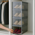 GoHooked grey acrylic stackable shoe box with magnetic front door, displaying sneakers and a hand reaching for a pair.