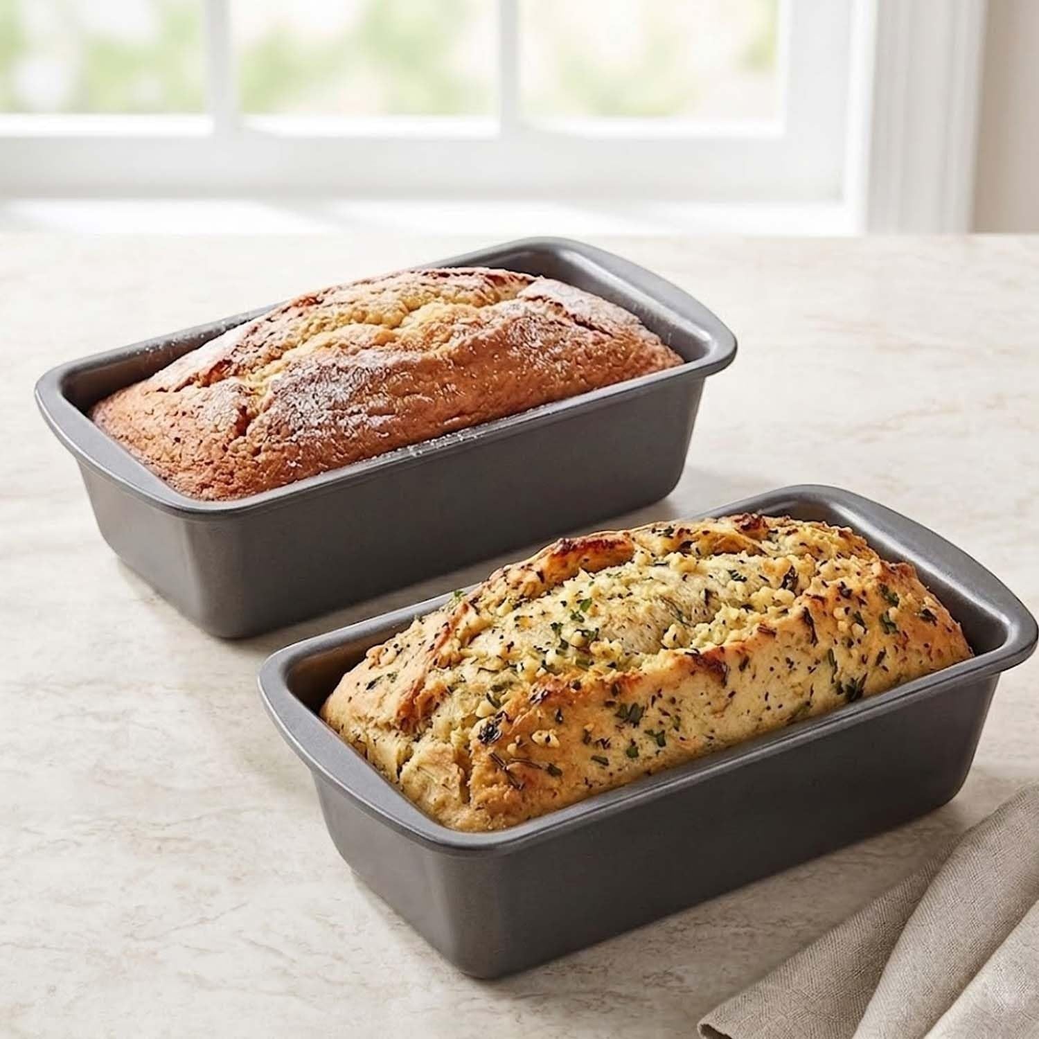 GoHooked grey carbon steel loaf pan with baked bread, perfect for cakes, brownies, and roasting.