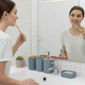 Go Hooked grey plastic bathroom accessory set with heart embossed design, includes soap dispenser, toothbrush holder, tumbler, and soap dish.