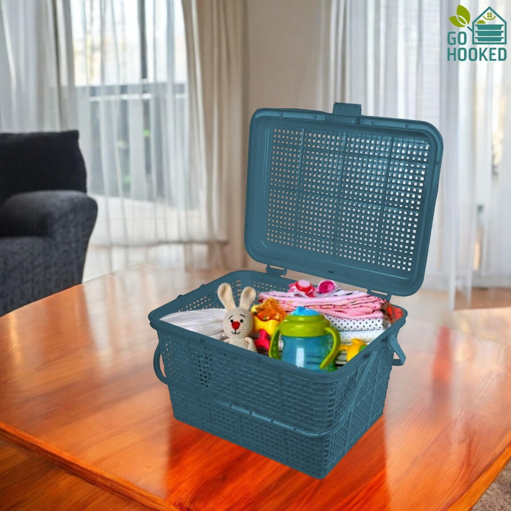 Go Hooked grey plastic storage basket with lid, handle, and snap lock, filled with baby items and toys.