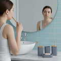 GoHooked grey ribbed bathroom accessories set with soap dispenser, toothbrush holder, tumbler, and soap dish.