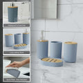 Go Hooked grey ribbed plastic bathroom accessories set with soap dispenser, toothbrush holder, tumbler, and soap dish.