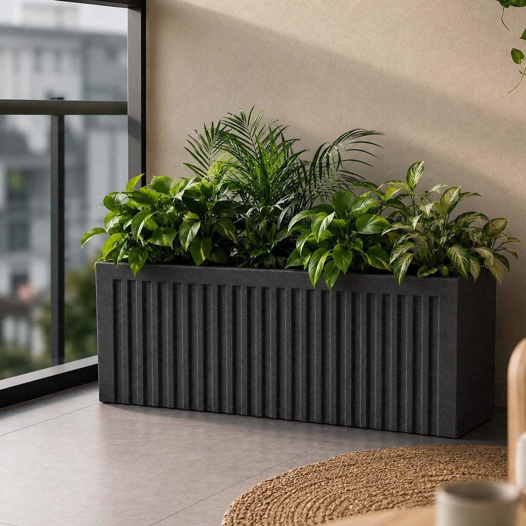 GoHooked grey rectangular polymer planter with vertical ribbed design, 24x12 inches, filled with lush green plants.