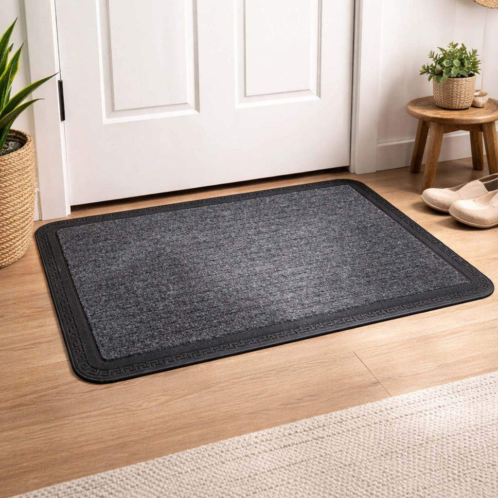GoHooked grey rubber door mat with a ribbed surface and decorative border placed on a wooden floor by an entrance.