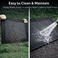 GoHooked grey rubber door mat with pebble texture and footprint design being cleaned by shaking and water rinsing