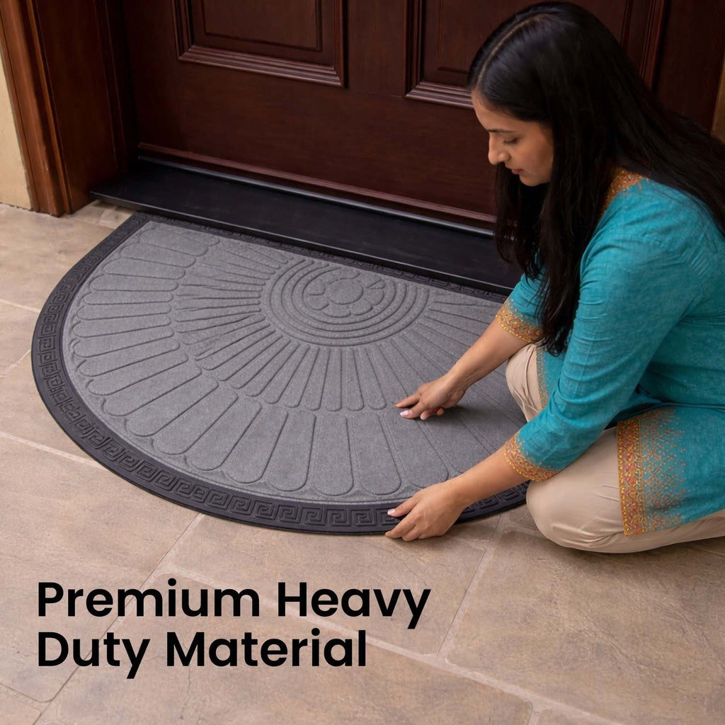 GoHooked grey rubber half circle door mat with sunburst pattern and black border placed at a home entrance.