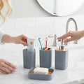 Go Hooked grey textured plastic bathroom accessory set with soap dispenser, toothbrush holder, tumbler, and soap dish.