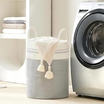 GoHooked cotton rope laundry basket in grey and white with sturdy handles, placed in a modern laundry room.