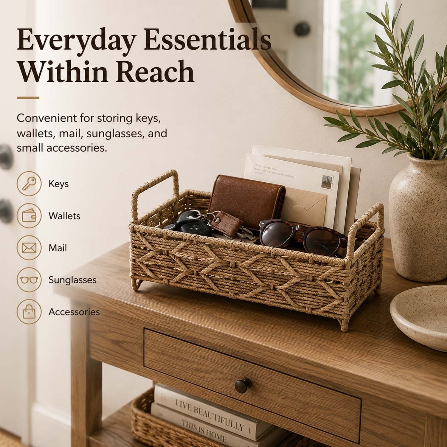 GoHooked handwoven raffia storage basket with handles on a wooden console table holding keys, wallet, and sunglasses.
