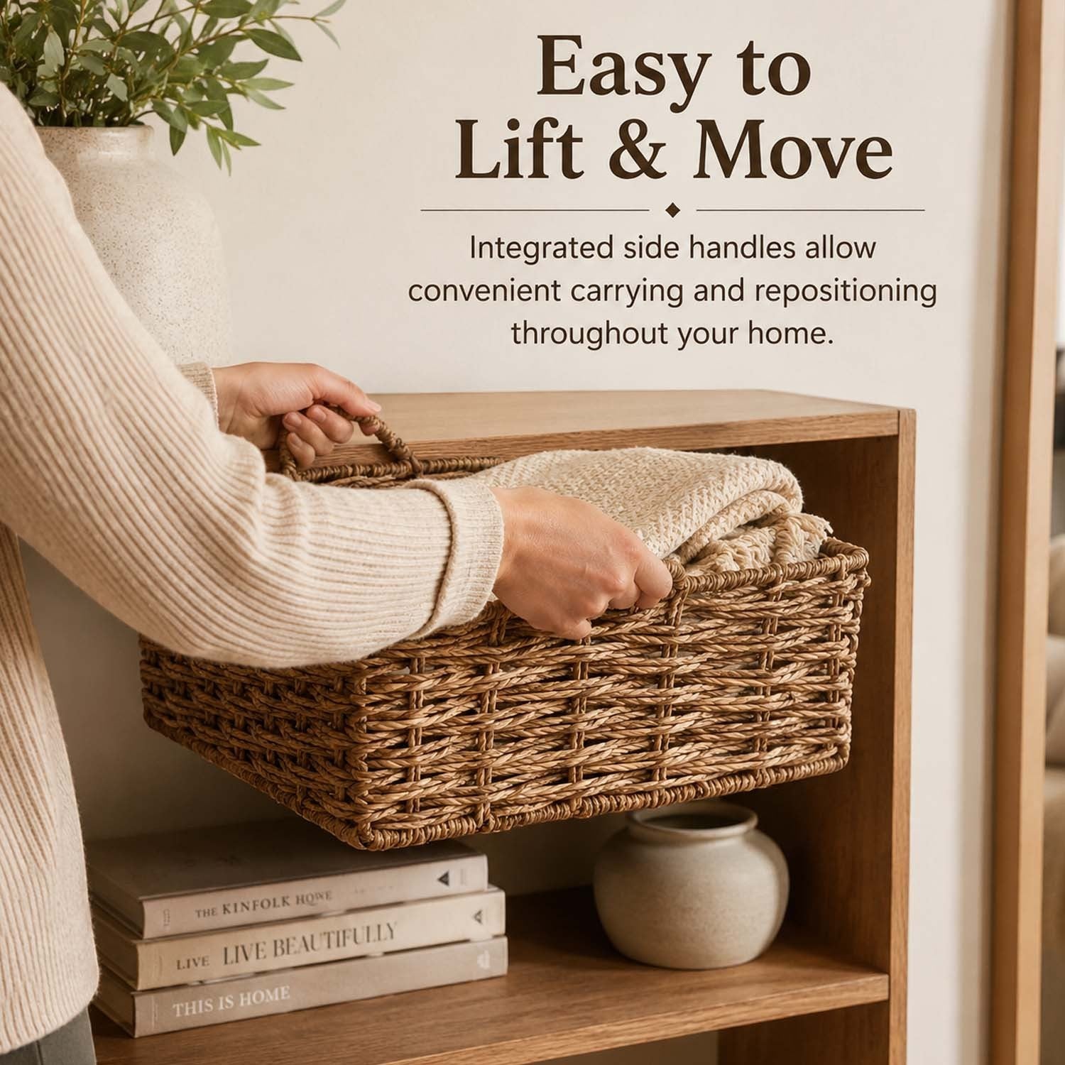 GoHooked handwoven raffia storage basket with side handles being lifted from a wooden shelf in a cozy room