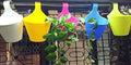 GoHooked multicolour plastic hanging planters, set of 7, for railing and balcony use.
