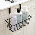 GoHooked black wire hanging storage basket over cabinet door holding shampoo and lotion bottles.