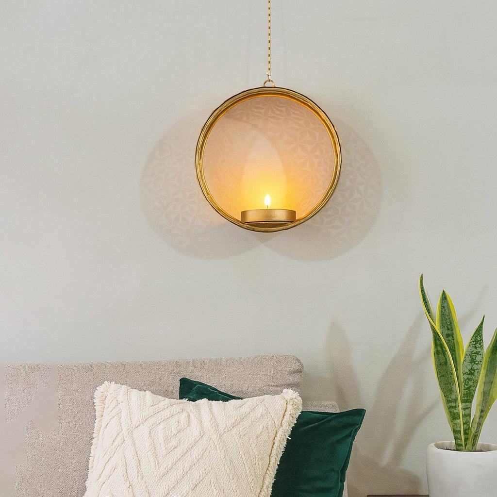 GoHooked matte gold metal round hanging tealight candle holder with floral cut design and chain.