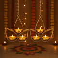 GoHooked golden metal hanging tealight candle holder with 3 trays, tear drop design, includes chain. Perfect for ambient lighting.
