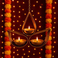 GoHooked golden metal hanging tealight candle holder with 3 tear drop cups and chain. Festive decor.