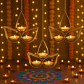 GoHooked golden metal hanging tealight candle holder with 3 cups in tear drop design, illuminated with lit candles.