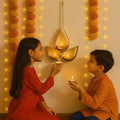 Go Hooked matte gold metal hanging tealight candle holder with 3 tear drop shaped trays and chain. Festive decor.