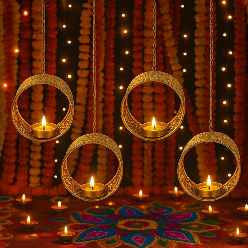 Set of 4 GoHooked matte gold metal hanging tealight candle holders with floral cut design and chains.