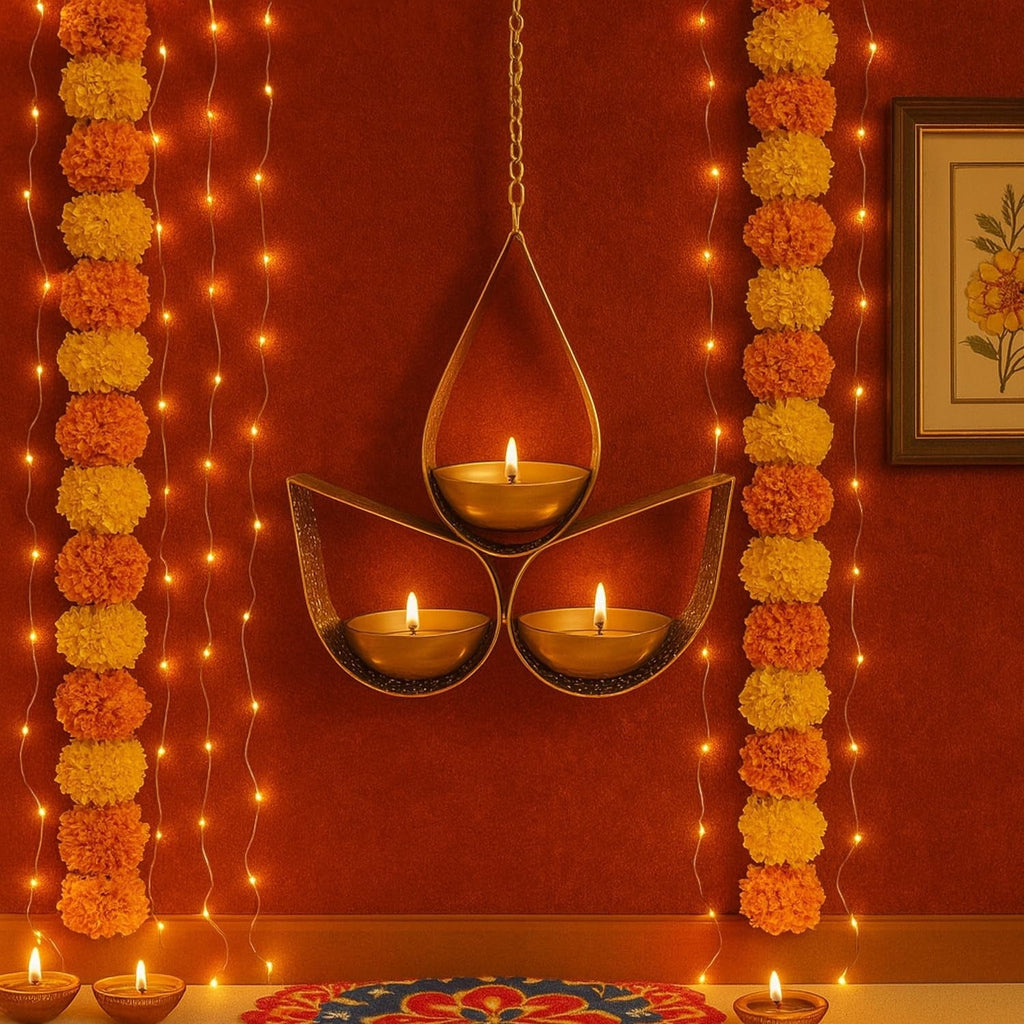 GoHooked matte gold metal hanging tealight candle holder with 3 tear drop shaped trays and chain. Festive decor.
