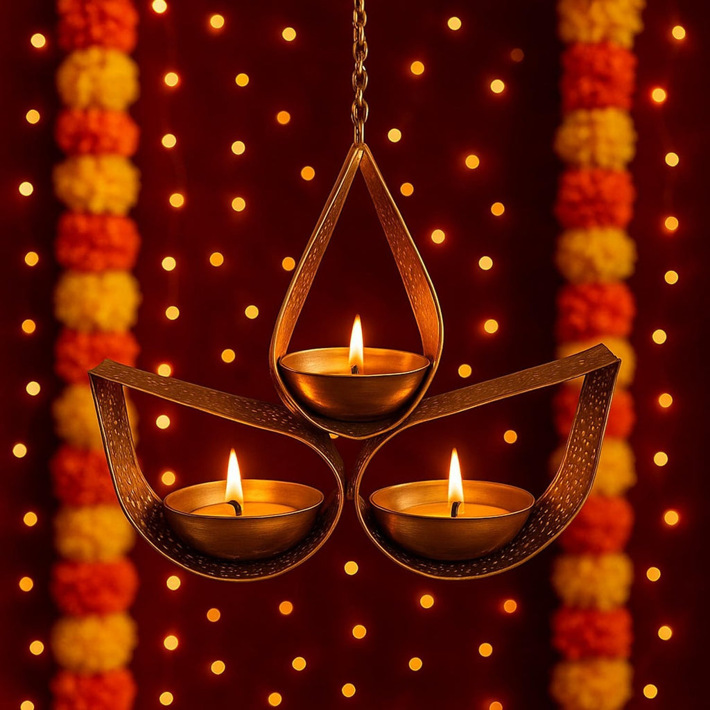 Go Hooked matte gold metal hanging tealight holder with three candle cups, ideal for Diwali decor.