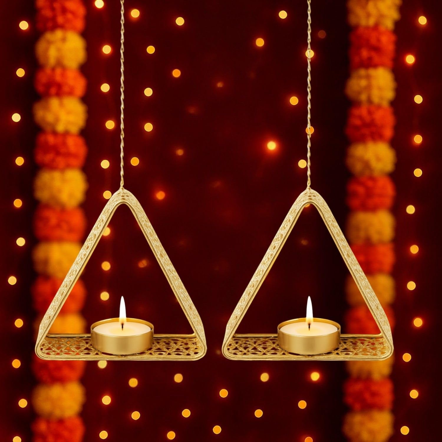 GoHooked set of 4 matte gold metal triangular hanging tealight holders with intricate cutouts, perfect for festive decor.