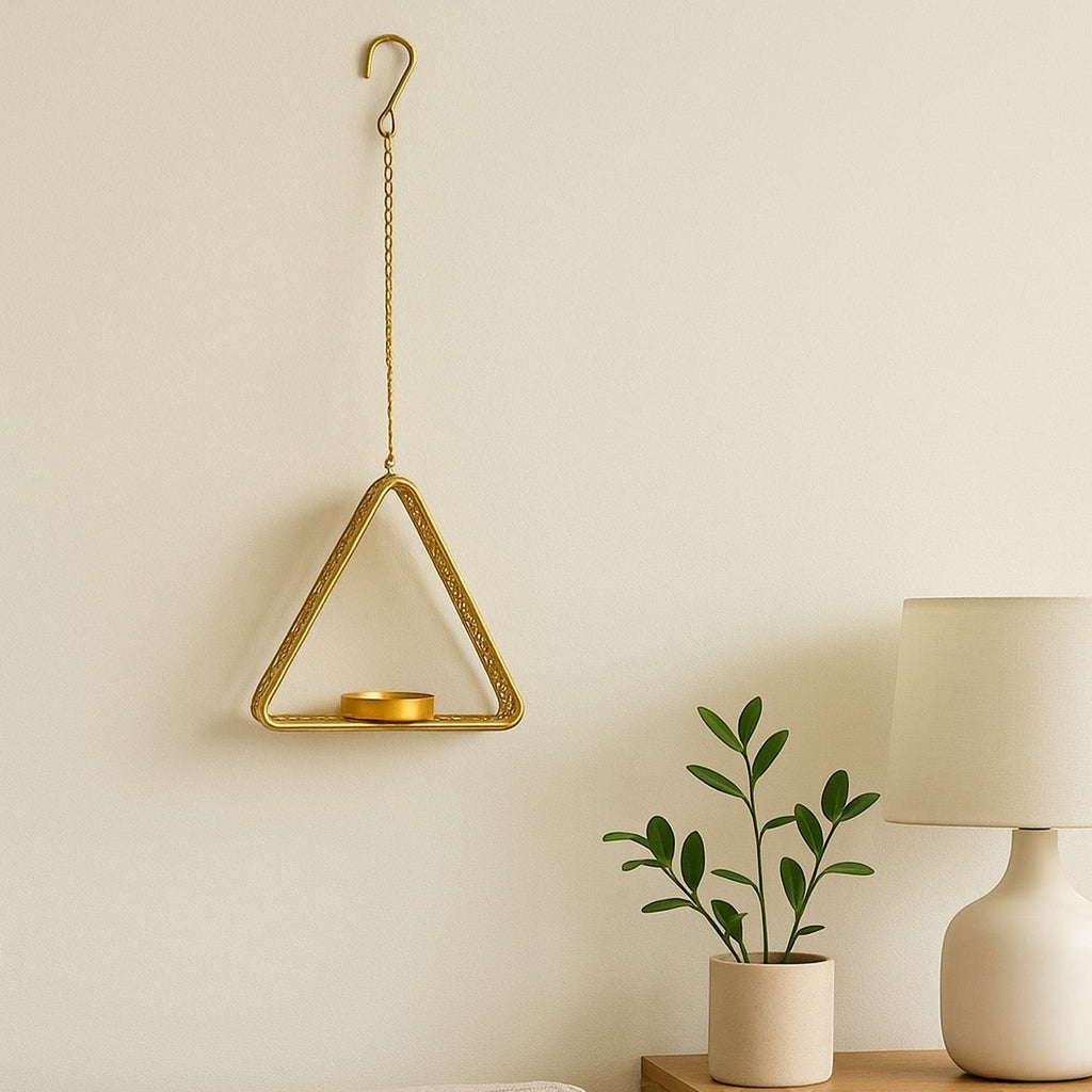 GoHooked matte gold metal hanging triangle tealight candle holder with floral cut design and chain.