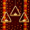 GoHooked matte gold metal hanging triangle tealight candle holders with floral cut design and chain.