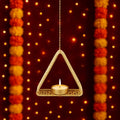 GoHooked matte gold metal hanging triangle tealight candle holder with floral cut design and chain.