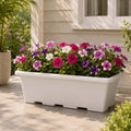 GoHooked Jupiter 24-inch white rectangular plastic planter filled with pink, purple, and white petunias on a tiled patio.
