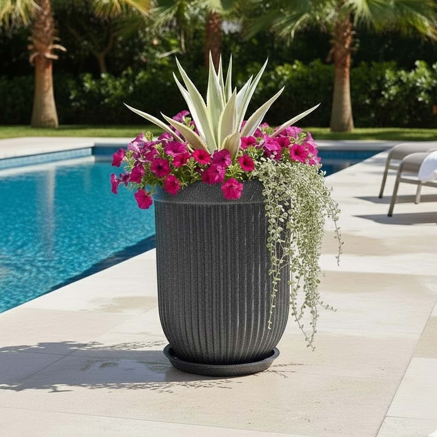 GoHooked 18-inch large grey polymer planter with ribbed design and matching saucer, filled with pink flowers and plants.