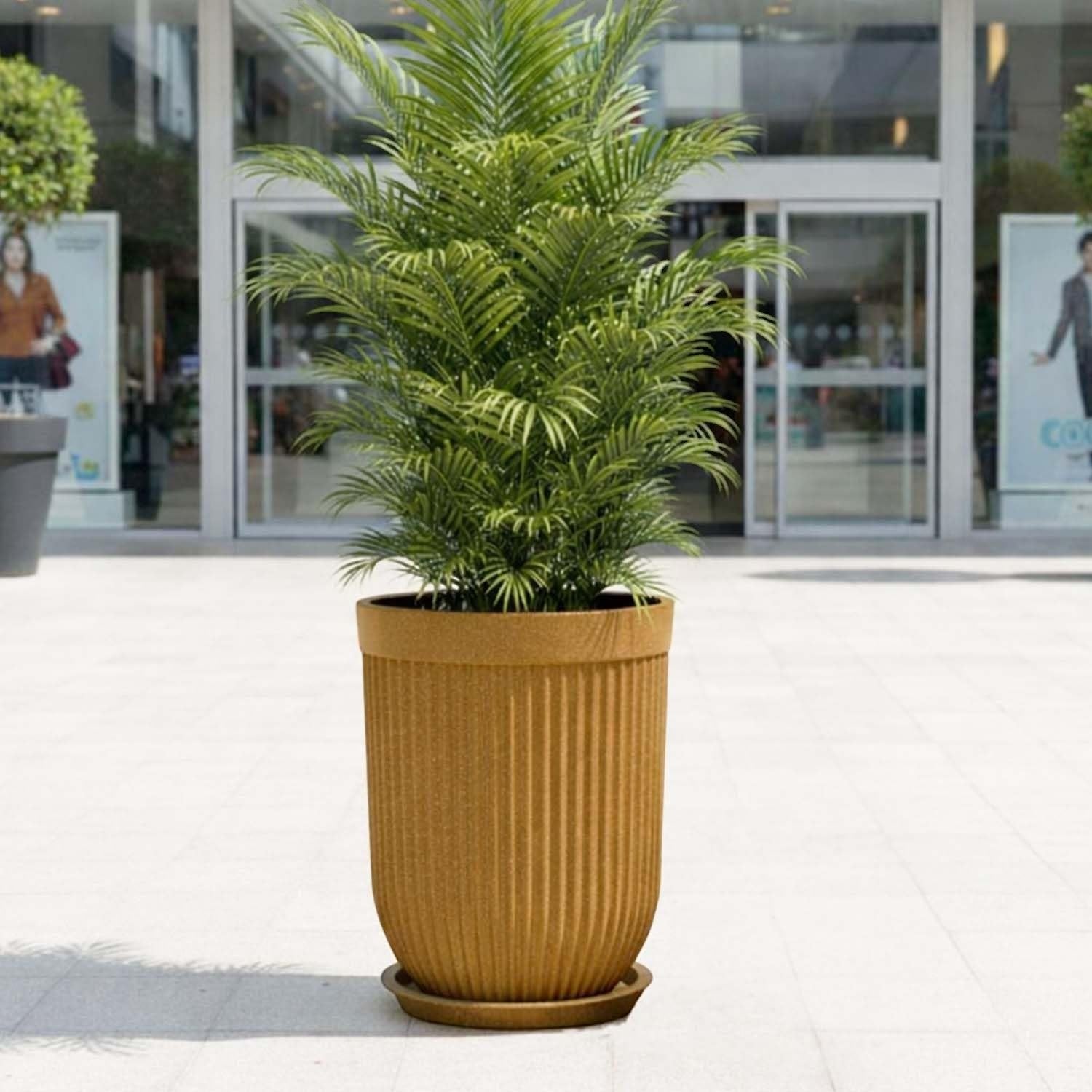 GoHooked 18 inch large ribbed polymer planter in tan with a matching saucer tray holding a green plant. Modern design.