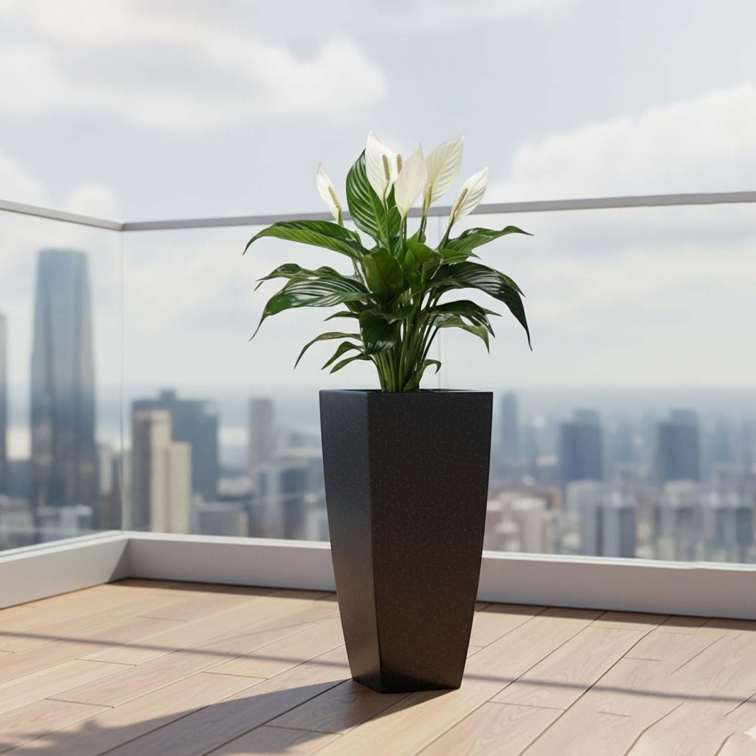GoHooked large white polymer planter with a peace lily plant on a balcony with city view.