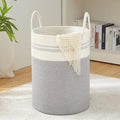Go Hooked large woven laundry basket in brown and grey with white handles, featuring a waterproof lining and foldable design.
