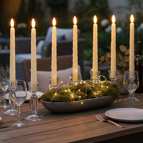 GoHooked ivory LED taper candles set of 3, 26.7cm tall, with flickering flames and spiral design, on a table with fairy lights.