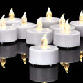GoHooked white LED tea lights with flickering yellow flames, perfect for romantic ambiance and decor.