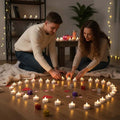 GoHooked LED tealight candles arranged in a heart shape on the floor by a couple, perfect for romantic occasions.